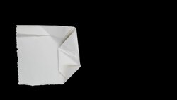 A sheet of paper folds into a small triangle, then unfolds. Stock Footage