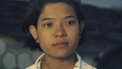 M/S-C/U Burmese teenage girl in an urban flat roof in an abandoned building at sundown Stock Footage