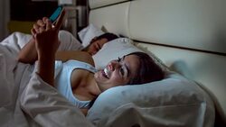 Woman social networking in bed Stock Footage