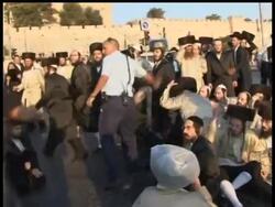 Ultra-Orthodox demonstrators scuffled with police in Jerusalem on Saturday in a protest over a decision by the city's mayor to open a municipal car park on the Sabbath. News Clip