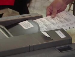 ECU, Woman inserting voting ballot into ballot box, St. Marys, Ohio, USA Stock Footage