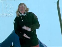 Two Norwegian men camping in the snowy mountains, have breakfast and plan their ski trip, 1970s Stock Footage