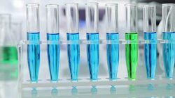 Beakers and test tubes on table Stock Footage