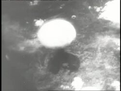 A mushroom cloud rises after an atomic bomb hits Hiroshima, Japan. News Clip