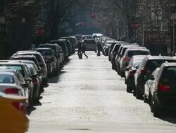 WS View of cars and pedestrians crosses shining Stone pavement street at SOHO / New York, United States Stock Footage