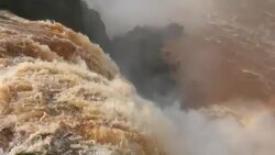 Top shot and overview of waterfalls and rainbow at Iguazu falls Stock Footage