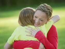 Mother hugs son Stock Footage