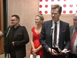 Bono and Damien Hirst Paint the Town Red For Aids In Africa - The (RED) Auction Stock Footage
