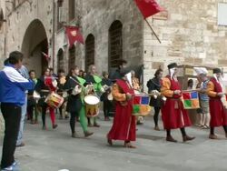 MS PAN Medieval band walking through streets / San Gimignano, Tuscany, Italy   Stock Footage