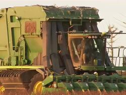 CU of harvester moving across cotton field. Stock Footage