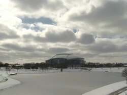 WS T/L View over frozen pond at Super Bowl XLV with Cowboys Stadium / Arlington, Texas, United States Stock Footage