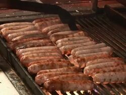 CU Typical way of barbequeing special sausage on town / NÃŒ_rnberg, Bavaria, Germany Stock Footage
