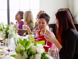 MS group of friends sitting at dinner party in loft eating dinner Stock Footage
