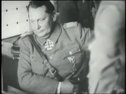 Hermann Goering surrenders his gun and belt. News Clip