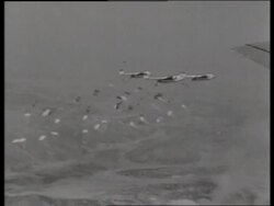 B/W 1950's air-to-air parachutes dropping from airplanes / C119 "Boxcar" / Korea / NO SOUND Stock Footage