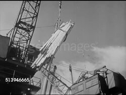 1940s: CAPE TOWN PORT: VS Crates being lifted onto cargo ship docked in port, lumber being lifted, loaded, various cranes loading cargo, supplies, unloading boxes from trucks & cargo train, crates marked 'SDO PORT SAID.' Exporting, exports, war effort Instructional Video