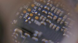 Close-up of Circuit Board under the Magnifying Glass Stock Footage