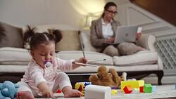 Baby daughter of mom entrepreneur playing at home Stock Footage