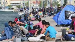 Syrian migrants fleeing the war and escaping to Europe, who have landed on the Greek island of Lesvos on the north coast at Efthalou. Up to 4,000 migrants a day are landing on the island and overwhelming the authorities. They are traficked by illegal Turki Stock Footage