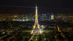 Elevated view of the Eiffel Tower, city skyline and La Defence skyscrapper district in the distance, Paris, France, Europe - Time lapse Stock Footage