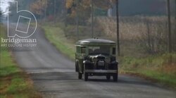 Bus driving through the countryside, 1930s - reenactment Stock Footage