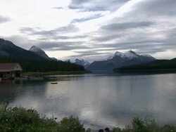 WS PAN View of lake with boathouse and motorboats / Jasper, Alberta, Canada  Stock Footage
