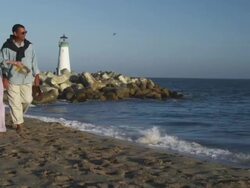 MS TU Couple walking down beach / Santa Cruz, California, United States Stock Footage