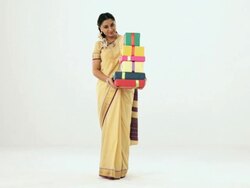 Portrait of a south Indian woman showing lots of gift box  Stock Footage