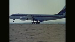 WS TS Douglas DC-8 landing on runway in desert, drives into airport / United States Stock Footage