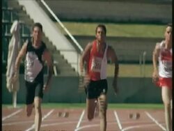 MS tilt up to athletes running to camera on track, Australia Stock Footage