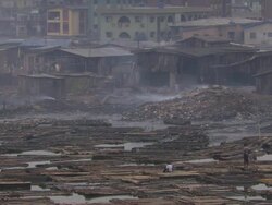 MS Village with logs, trashes and smoke / Lagos, Nigeria Stock Footage