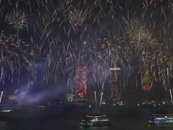 Fireworks shoot up and explode from floating barges in Hong Kong's Victoria Harbour, East Asian Games Opening Ceremony Fireworks Display, December 2009 Stock Footage