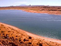 WS PAN across Lake Powell  in Glen Canyon National Recreation Area with speed boats and house boats on the lake / Page, Arizona, USA Stock Footage