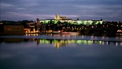 Boats travel on the Vltava River near Prague Castle. Stock Footage