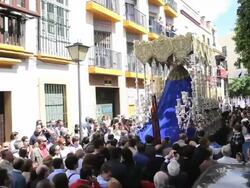 Golden Trono a religious float being carried by the Costaleros during Semana Santa, a procession through the streets of Malaga, Spain, Europe Stock Footage