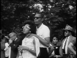 B/W August 28, 1963 young Black couple watching Marian Anderson sing at March on Washington Stock Footage