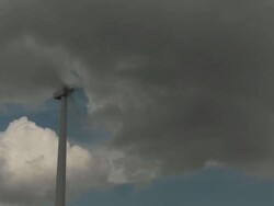 MS T/L Shot of cumulus clouds and wind turbine / Buffalo, Oklahoma, United States Stock Footage