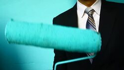 businessman hand hold Paint Roller Stock Footage
