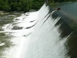 Water Cascading Down a Hydroelectric Power Dam Stock Footage