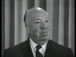 July 25, 1963 CU Alfred Hitchcock being interviewed/ England/ AUDIO Stock Footage