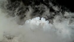 Dry ice dissolving. Steam whirling around the glass. Stock Footage