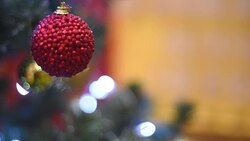 Christmas decorations on the Christmas tree with festive garland. Stock Footage