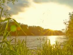 HD Motion Time-Lapse: River At Sunset Stock Footage