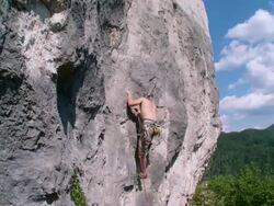CRANE: Man Climbing A Rock Stock Footage