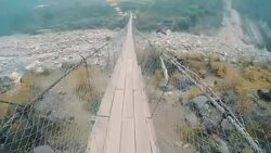 Crossing the footbridge Stock Footage