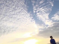A group of guys playing flag football on the beach. - Slow Motion Stock Footage