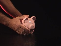 Beaking the Piggy Bank Stock Footage