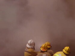 MS ZO Firemen working on burning rural information booth / Unspecified Stock Footage
