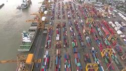 Aerial shot of large container ship at dock Stock Footage