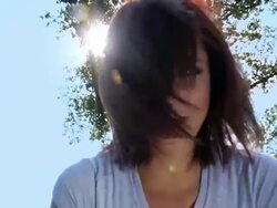 HD: Girl throwing her hair with lens flare Stock Footage